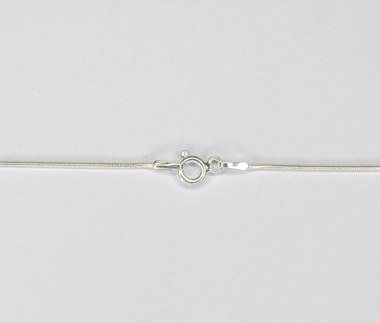 Long twizzle pendant in dark sterling silver with white coin pearl on mini snake chain.