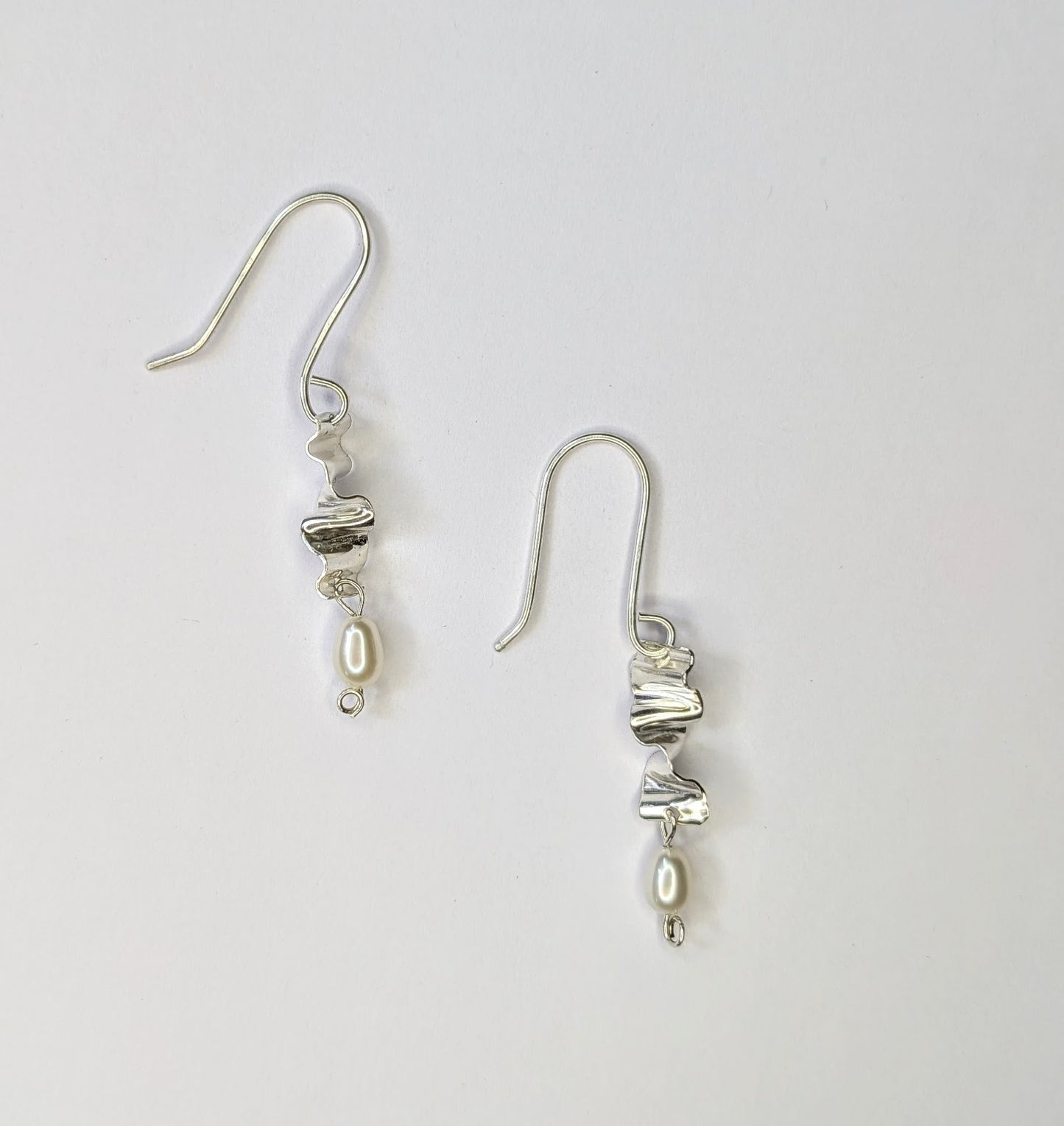 Small silver earrings with pearls