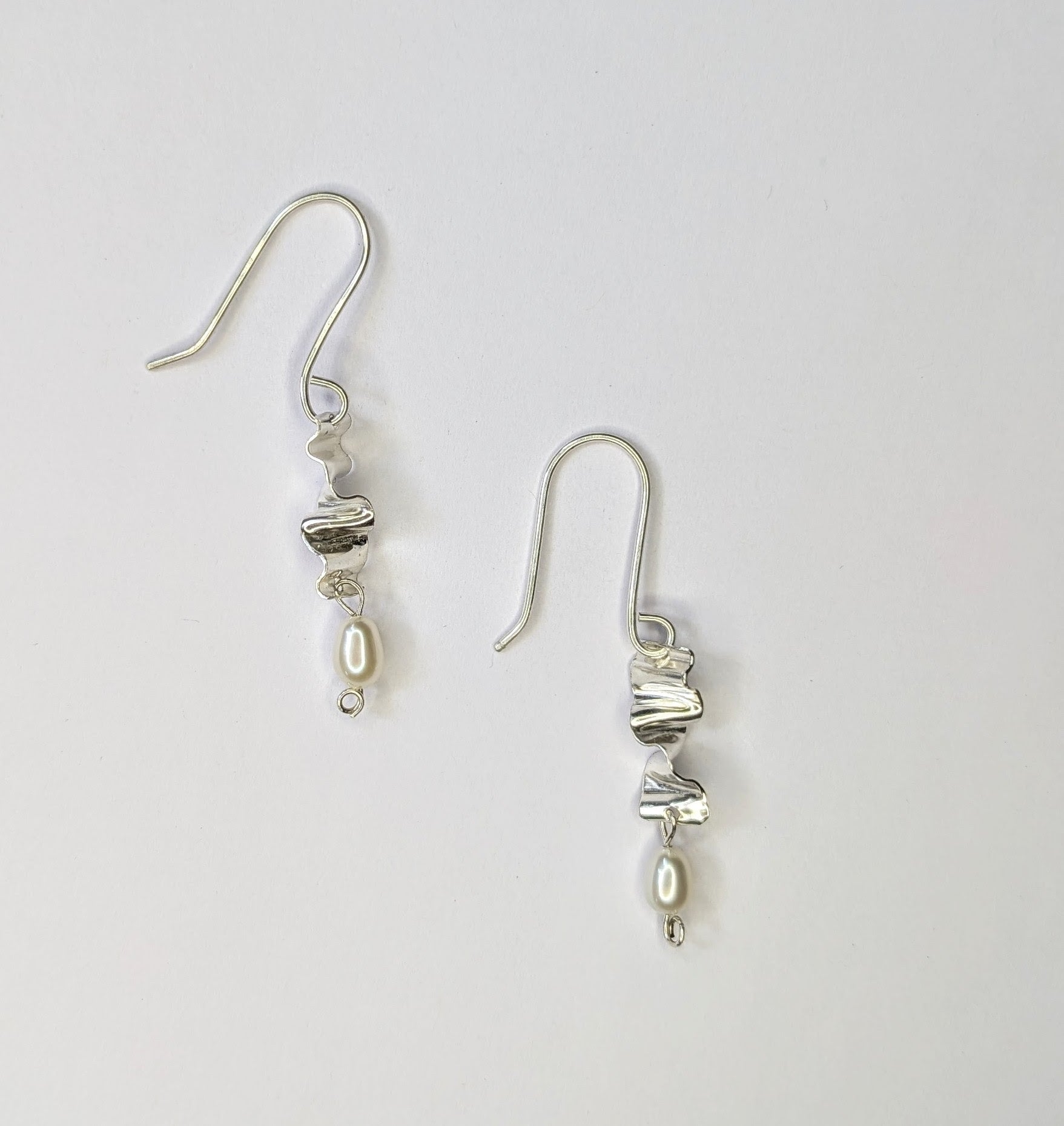 Small silver earrings with pearls