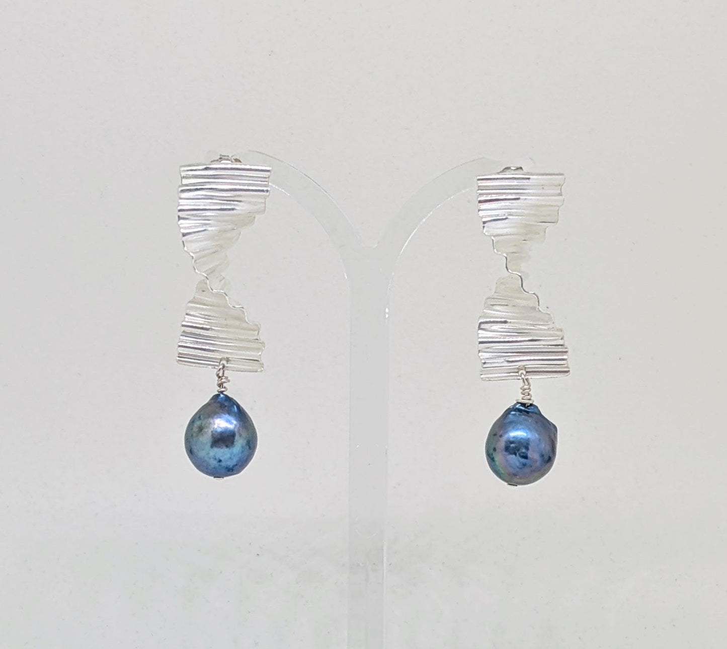 Large ripple earrings with large blue pearl