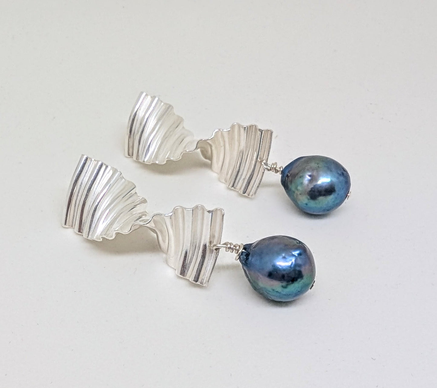 Large ripple earrings with large blue pearl