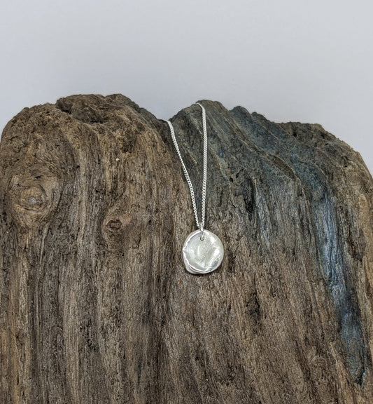 Reversible silver splash pendant