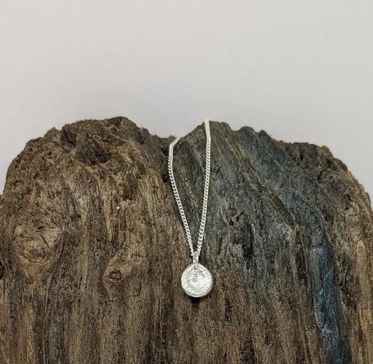 Reversible silver splash pendant